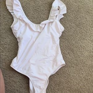 White ruffle bathing suit/body suit.